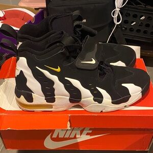 Nike Black and White Sneakers with Gold Accents